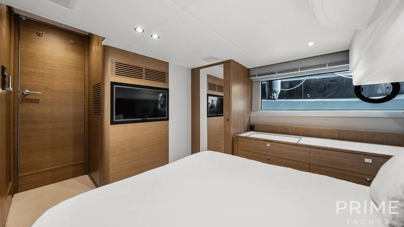  Yacht Photos Pics Luxurious 2019 Princess F49 yacht bedroom with modern wood finishes and sleek design.