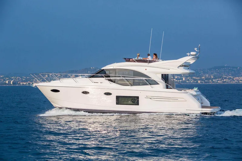 Yacht Photos Pics 2019 Princess F49 yacht cruising on open water with passengers onboard.