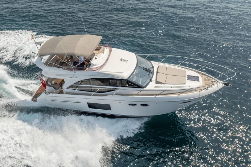  Yacht Photos Pics Luxurious 2019 Princess F49 yacht cruising on open sea, showcasing sleek design and elegance.