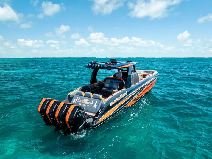 Casual Acquaintance Yacht Photos Pics 2024 Deep Impact 399 Sport boat cruising on clear blue ocean waters.