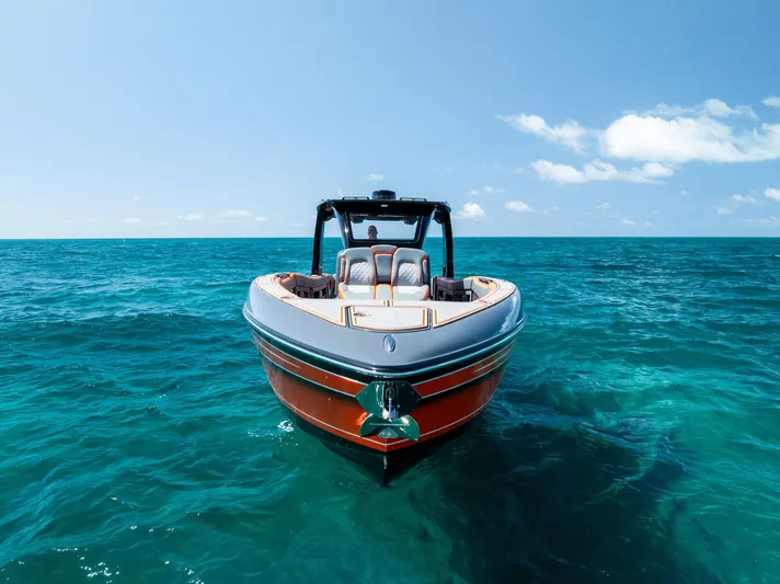 Casual Acquaintance Yacht Photos Pics 2024 Deep Impact 399 Sport boat on clear blue ocean water.