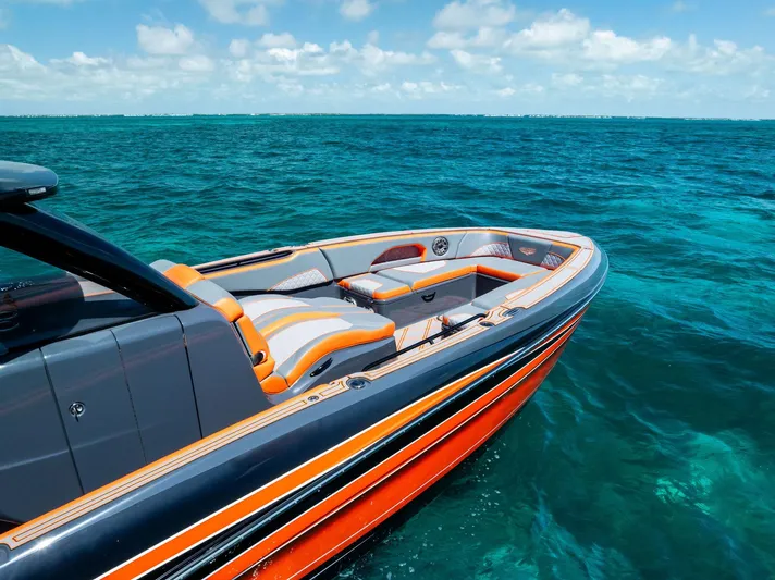 Casual Acquaintance Yacht Photos Pics 2024 Deep Impact 399 Sport boat on clear blue ocean water.