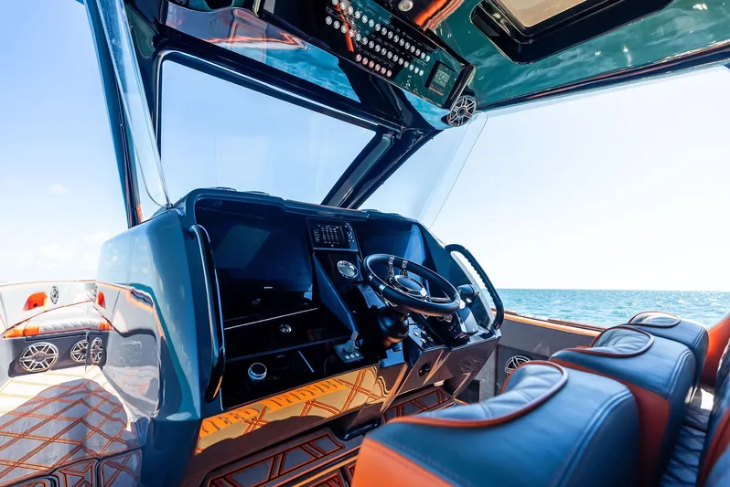 Casual Acquaintance Yacht Photos Pics 2024 Deep Impact 399 Sport boat interior with modern dashboard and ocean view.