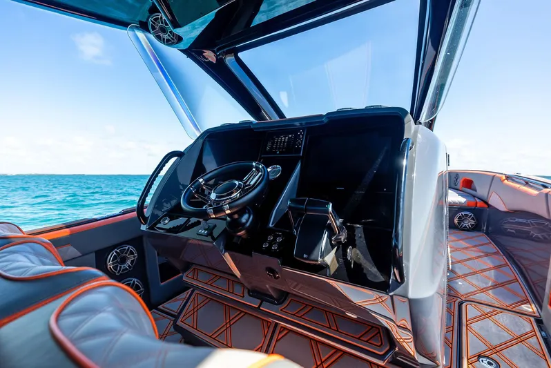 Casual Acquaintance Yacht Photos Pics 2024 Deep Impact 399 Sport boat cockpit with luxurious interior and ocean view.