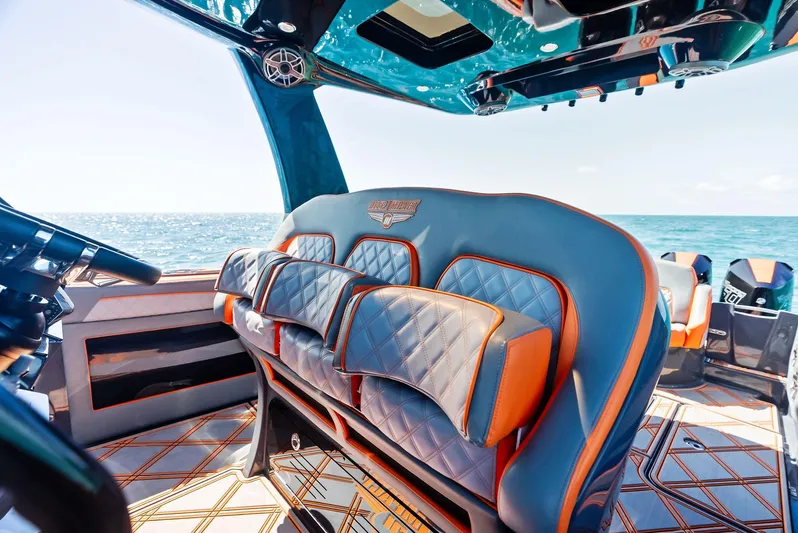 Casual Acquaintance Yacht Photos Pics Luxurious interior of 2024 Deep Impact 399 Sport boat with stylish seating and ocean view.