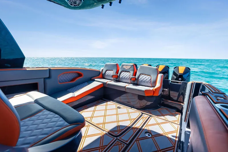 Casual Acquaintance Yacht Photos Pics 2024 Deep Impact 399 Sport boat interior with luxurious seating, ocean view, and modern design.