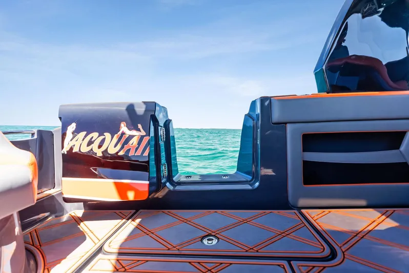 Casual Acquaintance Yacht Photos Pics 2024 Deep Impact 399 Sport boat with open deck, vibrant design, and ocean view.