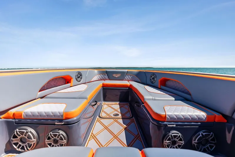 Casual Acquaintance Yacht Photos Pics 2024 Deep Impact 399 Sport boat interior with luxurious seating and ocean view.