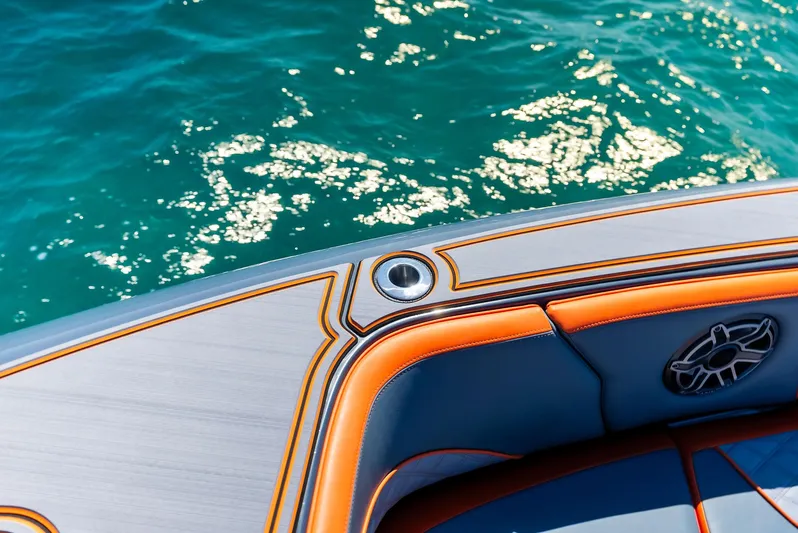 Casual Acquaintance Yacht Photos Pics 2024 Deep Impact 399 Sport boat detail with vibrant upholstery and ocean backdrop.