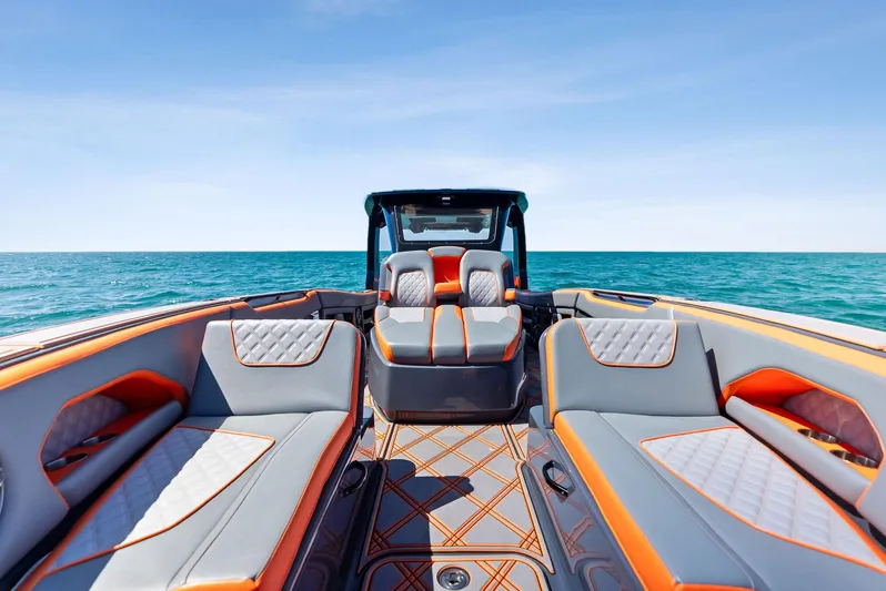 Casual Acquaintance Yacht Photos Pics 2024 Deep Impact 399 Sport boat interior with luxurious seating on open water.