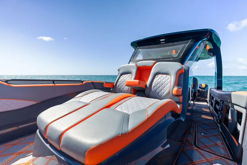 Casual Acquaintance Yacht Photos Pics 2024 Deep Impact 399 Sport boat interior with luxurious seating, ocean view, and modern design.