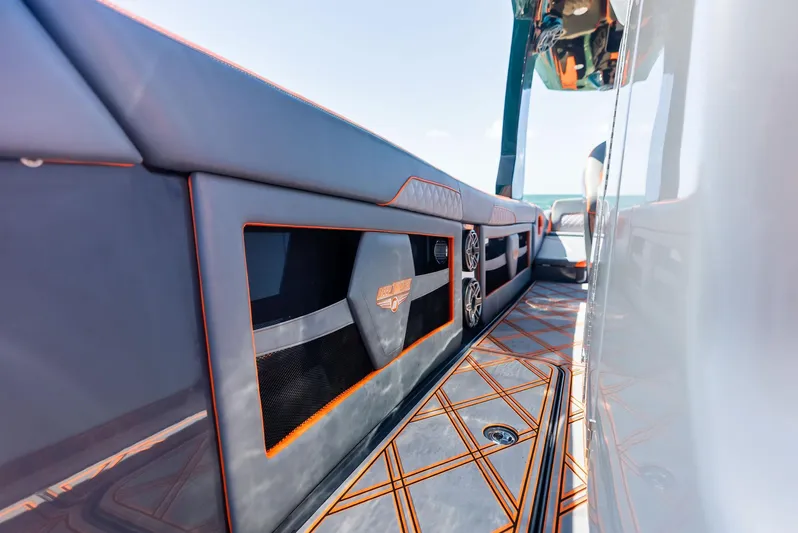 Casual Acquaintance Yacht Photos Pics 2024 Deep Impact 399 Sport boat interior with sleek design and orange accents.