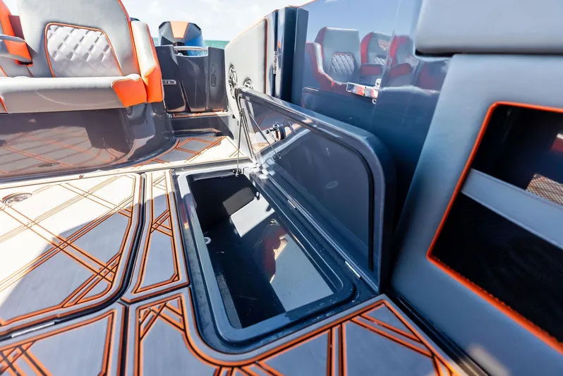 Casual Acquaintance Yacht Photos Pics 2024 Deep Impact 399 Sport boat interior with open storage compartment and stylish seating.