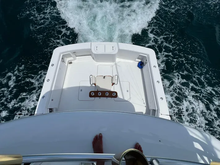  Yacht Photos Pics Aerial view of 2001 Ocean 52 Convertible yacht deck cruising through water.