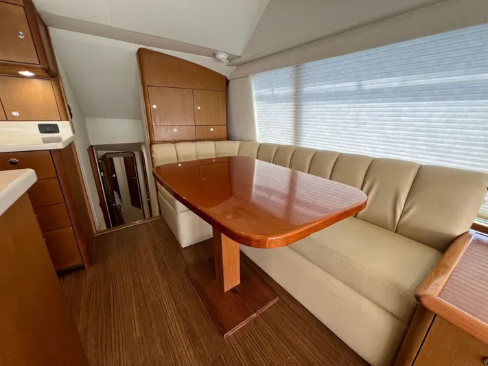  Yacht Photos Pics Luxurious interior of 2001 Ocean 52 Convertible yacht with elegant dining area.