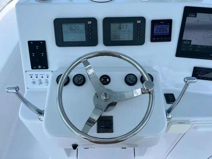  Yacht Photos Pics Steering wheel and controls of 2001 Ocean 52 Convertible yacht.