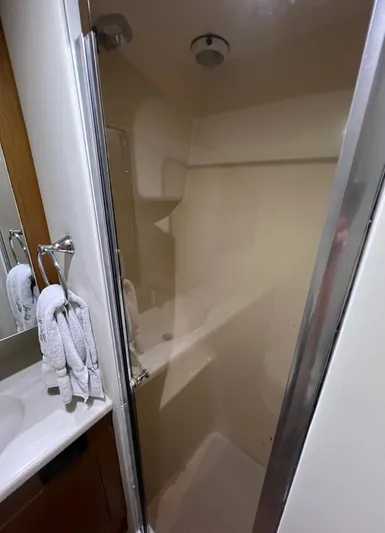 Yacht Photos Pics Shower area in 2001 Ocean 52 Convertible yacht bathroom.