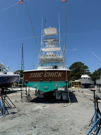 Side Chick Yacht Photos Pics 2002 Rampage 38 Express boat in dry dock, "Side Chick".