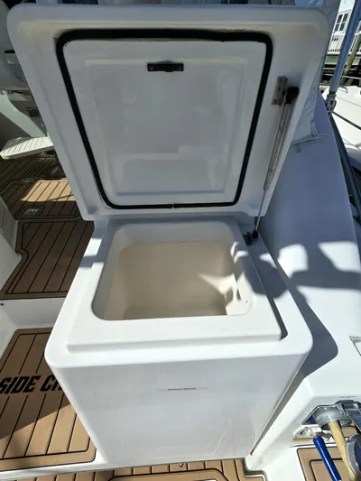 Side Chick Yacht Photos Pics Open storage compartment on a 2002 Rampage 38 Express boat.