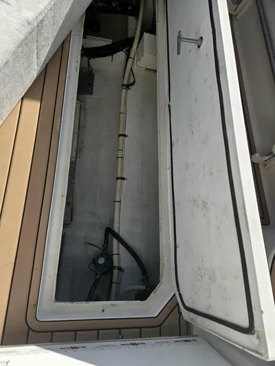 Side Chick Yacht Photos Pics Storage compartment in 2002 Rampage 38 Express boat.