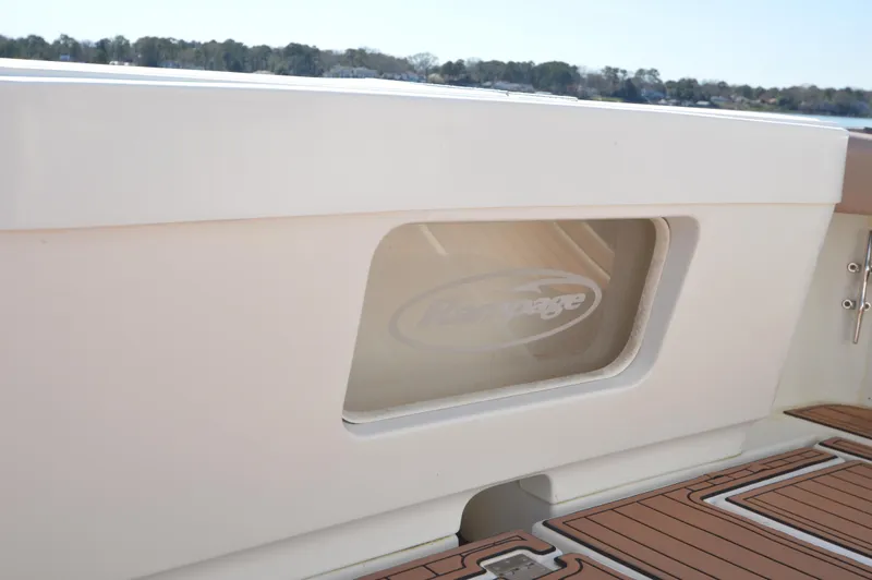 Side Chick Yacht Photos Pics Rampage 38 Express 2002 boat deck with logo.