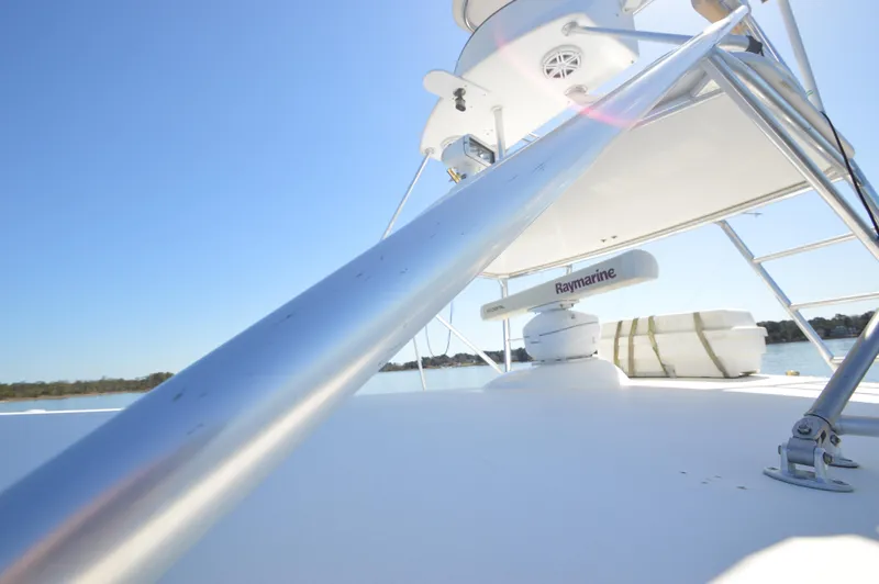 Side Chick Yacht Photos Pics 2002 Rampage 38 Express boat deck with Raymarine equipment.