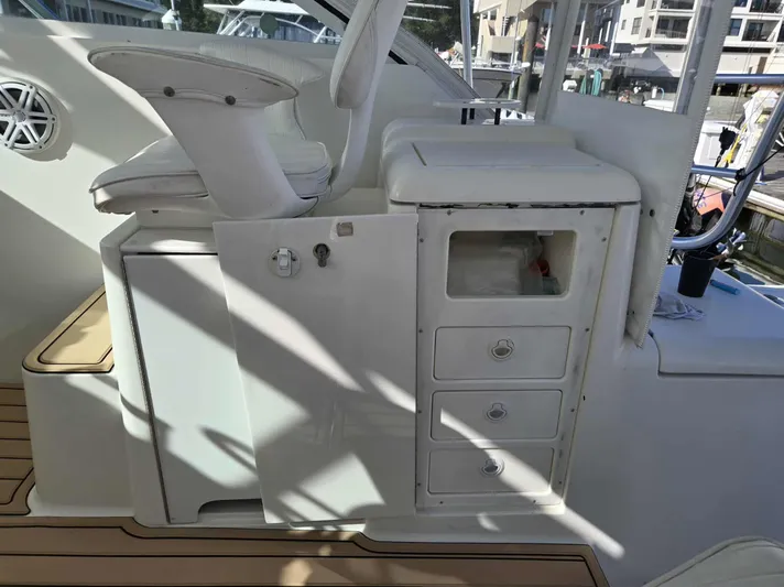 Side Chick Yacht Photos Pics Interior of a 2002 Rampage 38 Express boat with seat and cabinets.