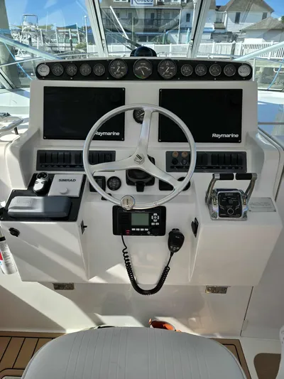 Side Chick Yacht Photos Pics Rampage 38 Express 2002 helm with Raymarine equipment.
