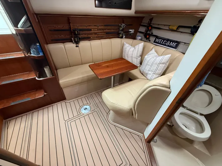 Side Chick Yacht Photos Pics Interior of a 2002 Rampage 38 Express yacht with seating area.
