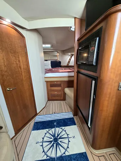 Side Chick Yacht Photos Pics Interior of a 2002 Rampage 38 Express yacht with wooden furnishings.