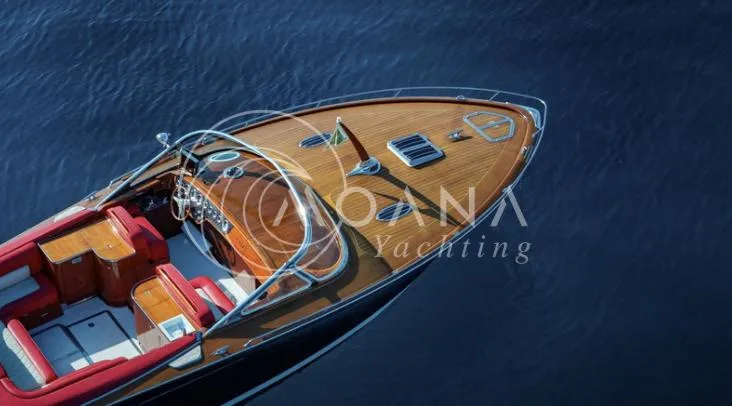 Temtation Yacht Photos Pics Luxurious 2011 J Craft Torpedo R 42 yacht with sleek wooden deck on calm water.