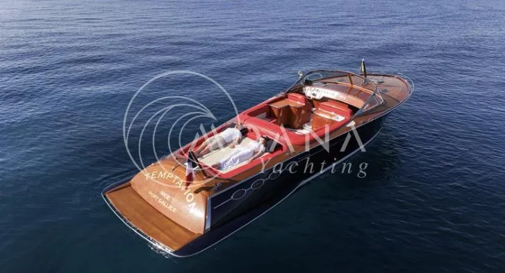 Temtation Yacht Photos Pics Luxury J Craft Torpedo R 42 yacht on calm blue water, 2011 model.