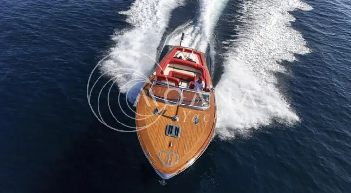 Temtation Yacht Photos Pics 2011 J Craft Torpedo R 42 yacht cruising on open water, top view.