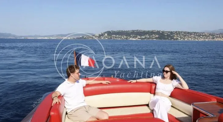 Temtation Yacht Photos Pics Couple relaxing on a 2011 J Craft Torpedo R 42 yacht, enjoying a scenic ocean view.