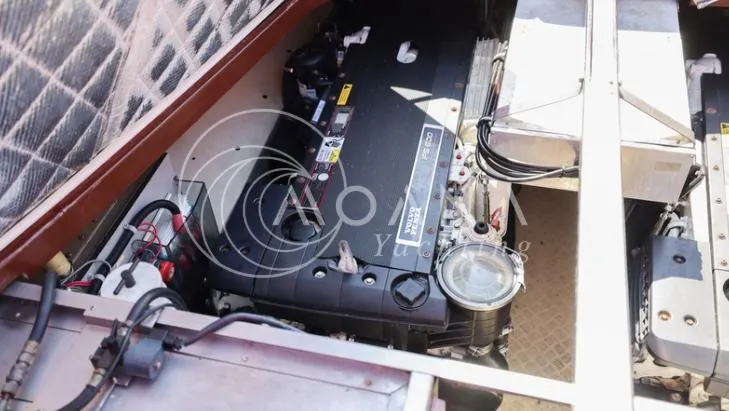 Temtation Yacht Photos Pics Engine compartment of a 2011 J Craft Torpedo R 42 yacht, showcasing detailed machinery.