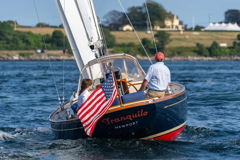 Tranquilo Yacht Photos Pics 2008 Morris Yachts M36 sailing with American flag, scenic coastal background.