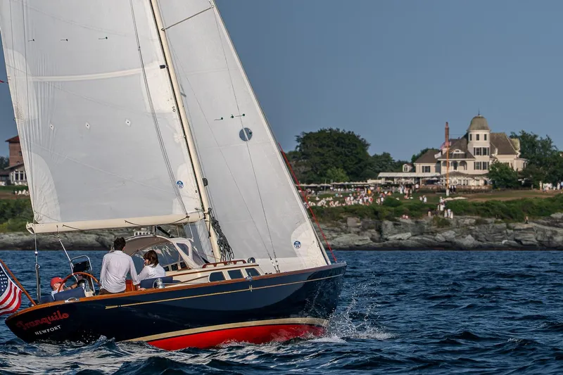 Tranquilo Yacht Photos Pics Sailing yacht Morris M36, 2008 model, gliding near scenic coastal estate.