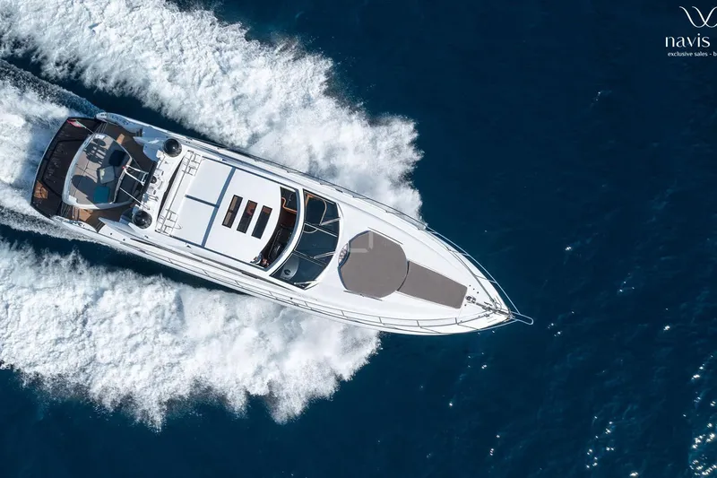  Yacht Photos Pics Aerial view of 2008 Sunseeker Predator 72 yacht cruising on blue ocean waters.