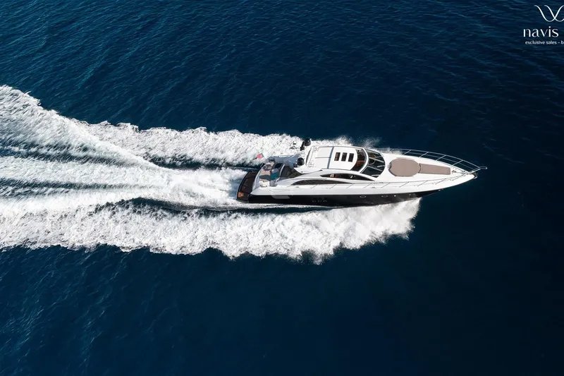  Yacht Photos Pics Aerial view of 2008 Sunseeker Predator 72 yacht cruising on open sea.