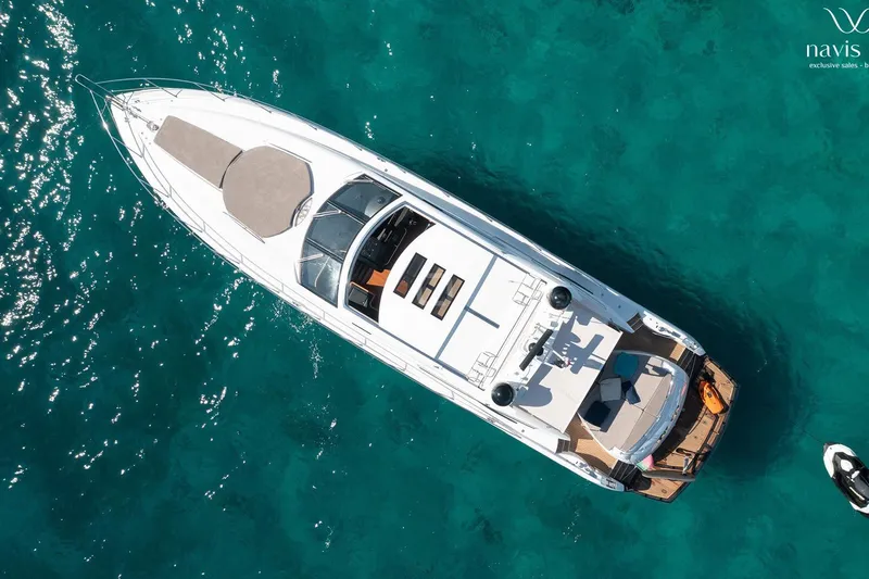  Yacht Photos Pics Aerial view of 2008 Sunseeker Predator 72 yacht on clear turquoise water.