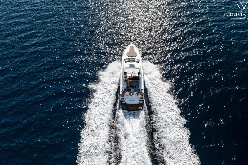  Yacht Photos Pics Aerial view of 2008 Sunseeker Predator 72 yacht cruising on open sea.
