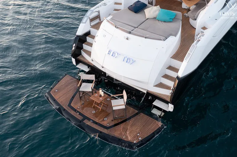  Yacht Photos Pics 2008 Sunseeker Predator 72 yacht with elegant deck setup on the water.