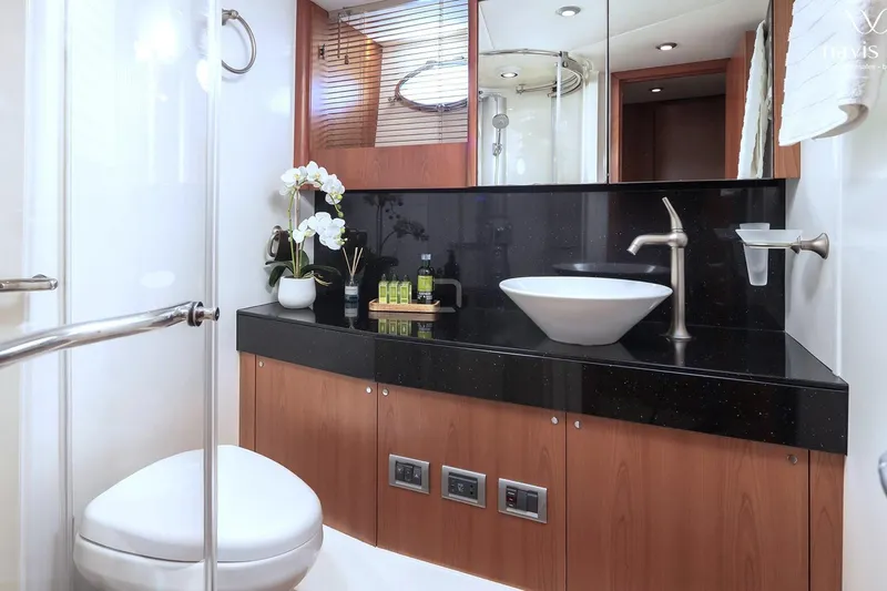  Yacht Photos Pics Luxurious bathroom in 2008 Sunseeker Predator 72 yacht with modern fixtures and elegant design.