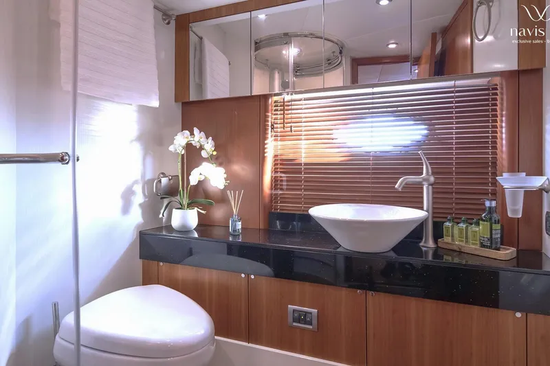 Yacht Photos Pics Luxurious bathroom in 2008 Sunseeker Predator 72 yacht with modern fixtures and elegant decor.