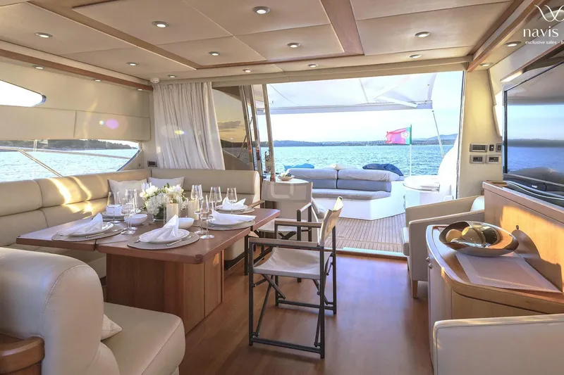 Yacht Photos Pics Luxurious interior of 2008 Sunseeker Predator 72 yacht with elegant dining setup and ocean view.