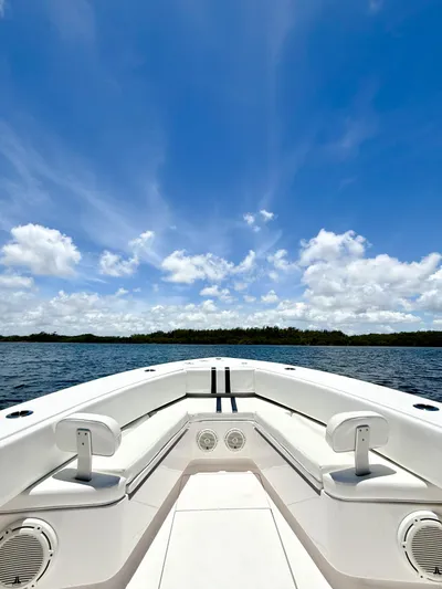 Relentless II W/ Seakeeper Yacht Photos Pics 2017 Contender 35 ST boat on open water under a clear blue sky.