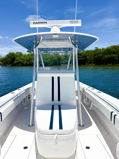 Relentless II W/ Seakeeper Yacht Photos Pics 2017 Contender 35 ST boat with Garmin equipment, docked on a sunny day.