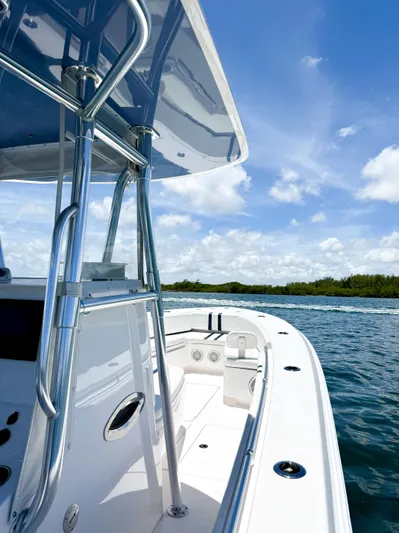 Relentless II W/ Seakeeper Yacht Photos Pics 2017 Contender 35 ST boat cruising on a sunny day with clear blue skies.