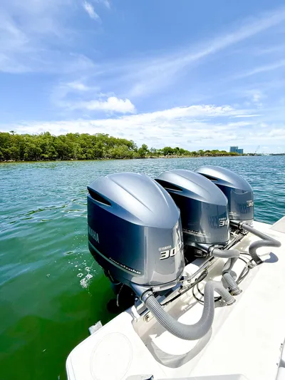 Relentless II W/ Seakeeper Yacht Photos Pics 2017 Contender 35 ST boat with triple Yamaha 300 engines on a sunny day.