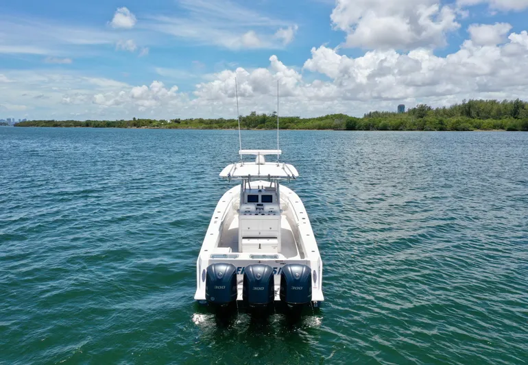 Relentless II W/ Seakeeper Yacht Photos Pics 2017 Contender 35 ST boat on open water under a clear blue sky.